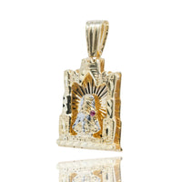 The St. Barbara Castle Shaped Pendant – 10k Gold features a detailed figure with a radiant background and a red chest accent, all set in an ornate frame. This men's religious jewelry is shown on a white background.