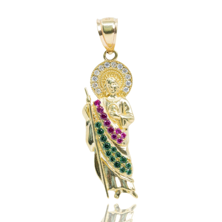 The Saint Jude Pendant in 14K Yellow Gold with CZ is a striking men’s gold pendant featuring a jeweled halo and multicolored CZ stones, including green and pink, for an eye-catching addition to any gold jewelry collection.