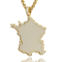 The 14k Gold France Flag Pendant with Lab Diamonds features a France-shaped design adorned with sparkling lab stones, elegantly displayed on a twisted gold chain.