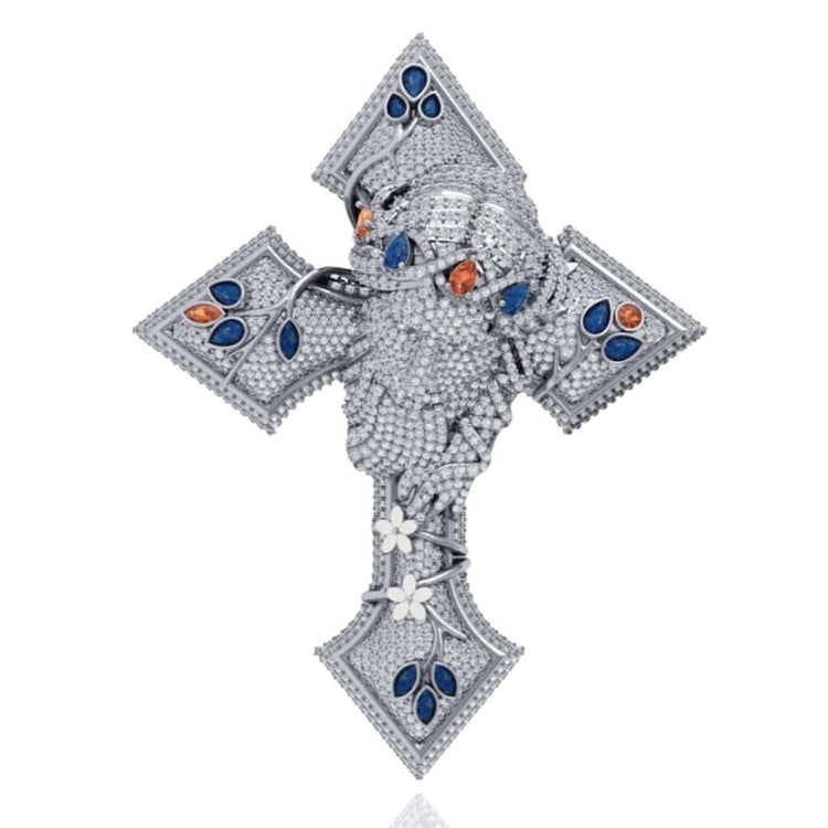 The Diamond Jesus Head Pendant with Sapphire and Ruby Accents features a sculpted diamond-encrusted face, highlighted by sapphire and ruby accents, plus white gemstones in leaf and flower motifs.
