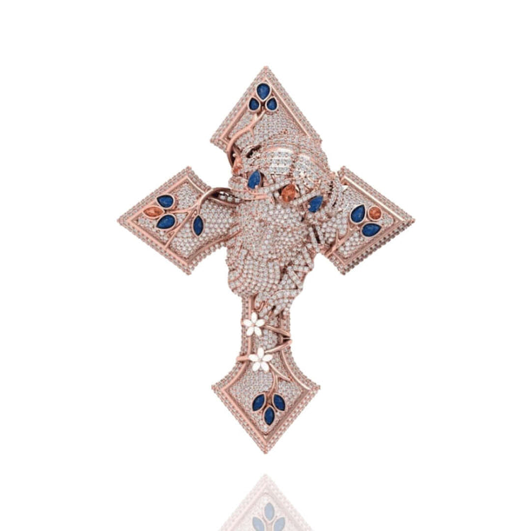 The Diamond Jesus Head Pendant features sparkling white and blue stones with sapphire and ruby accents, designed as a jeweled cross showcasing a detailed Jesus head at the center, set against a white background.