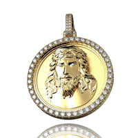 The 14K Gold Diamond Jesus Face Round Pendant displays a raised bearded Jesus with a crown of thorns, surrounded by clear gemstones and topped with a diamond-studded bail for added brilliance.
