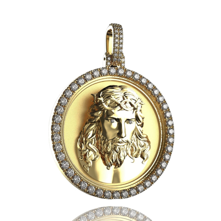 The 14K Gold Diamond Jesus Face Round Pendant features a detailed Jesus relief with a crown of thorns, surrounded by sparkling diamonds and a diamond-encrusted bail—an elegant addition to any necklace.