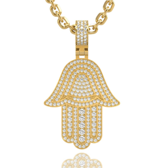 Alt="Celebrate protection and luck with the 14K Gold Hamsa Hand Pendant. Features intricate detailing, radiant 14K gold, and diamond accents for timeless sophistication."