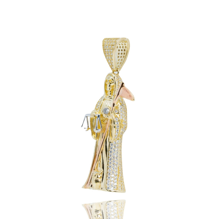 The Grim Reaper Pendant in 10k Gold is a bold men’s piece shaped like a robed figure with scales, adorned with small diamonds and a textured bail—an eye-catching accessory for any gold jewelry collection.