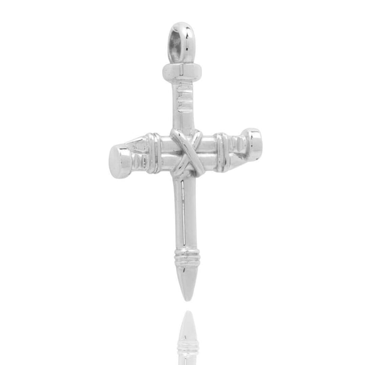 The Silver Nail Cross Pendant is crafted in sterling silver, featuring three crossed nails—one vertical and two horizontal—with detailed grooves and a polished finish, forming an elegant cross necklace.