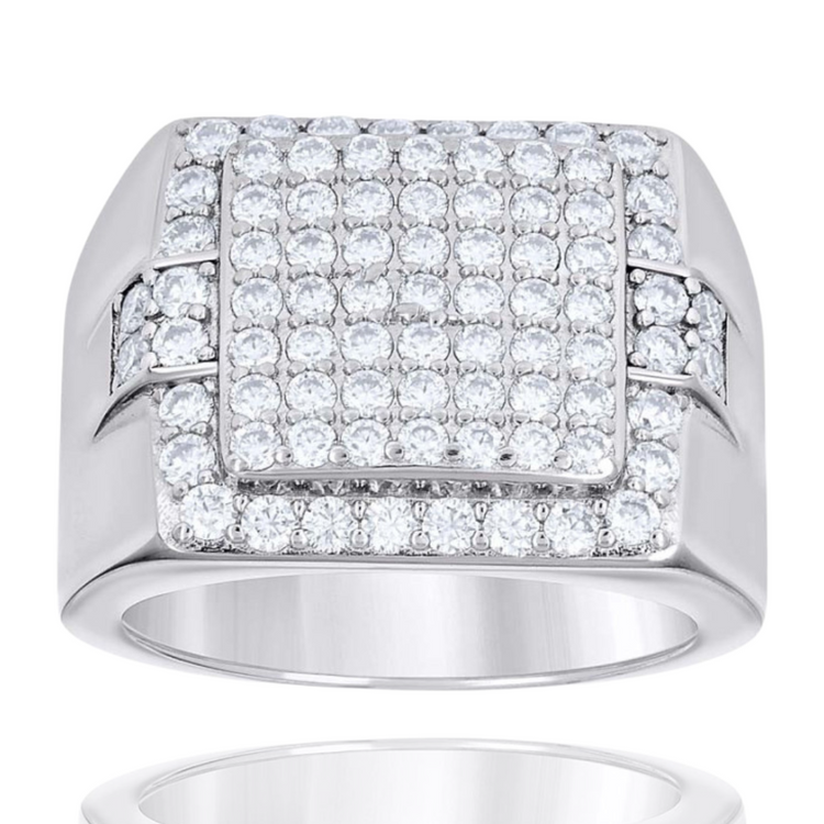 The Silver Moissanite Signet Ring showcases a raised square top adorned with multiple sparkling moissanites set in a geometric pattern.
