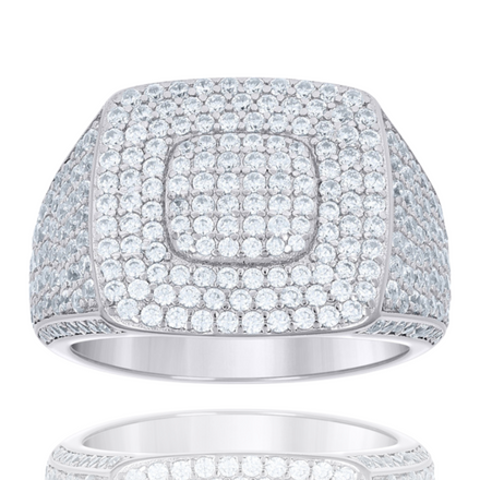 The Moissanite Square Head Fashion Ring features a wide silver band and a square-shaped top adorned with sparkling moissanite stones, creating a bold, modern statement piece. Its luxurious design is beautifully reflected below.