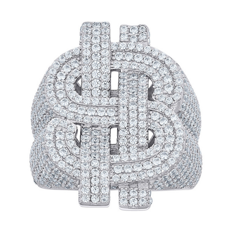 The Silver Moissanite Dollar Sign Ring is crafted from 925 Sterling Silver and features a bold dollar sign ($) design encrusted with sparkling moissanite stones, shown against a plain white background.