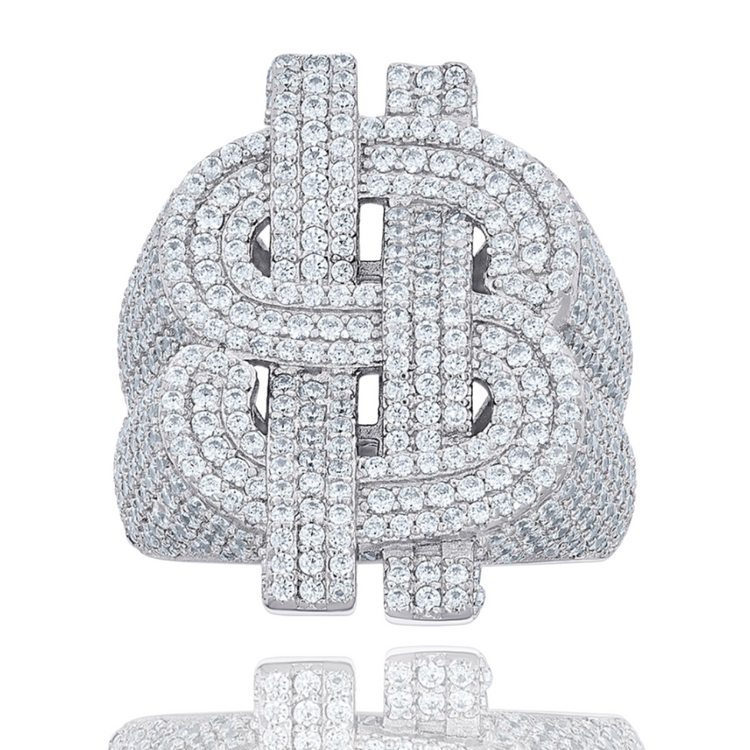 The Silver Moissanite Dollar Sign Ring, crafted in 925 sterling silver and adorned with rows of sparkling moissanite stones, shines brilliantly—an iconic statement piece for your collection.