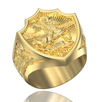 The George the Victorious Men Ring – 14k Gold features an ornate shield face with St. George slaying the dragon, Cyrillic script, and intricate side patterns—a standout piece for men's gold jewelry collections.