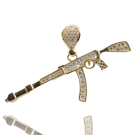 The AK-47 Firearm Pendant with CZ Stones in 14K yellow gold features small sparkling stones on the body and bail, shown against a white background.