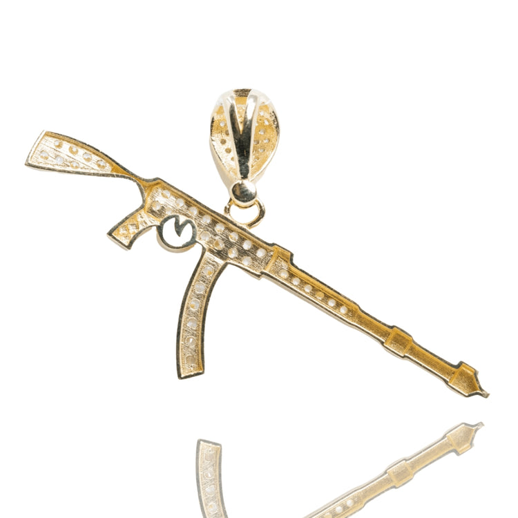 The AK-47 Firearm Pendant with CZ Stones in 14K yellow gold features rifle-shaped detailing, sparkling CZ accents, and a loop for chaining, shown against a white background.