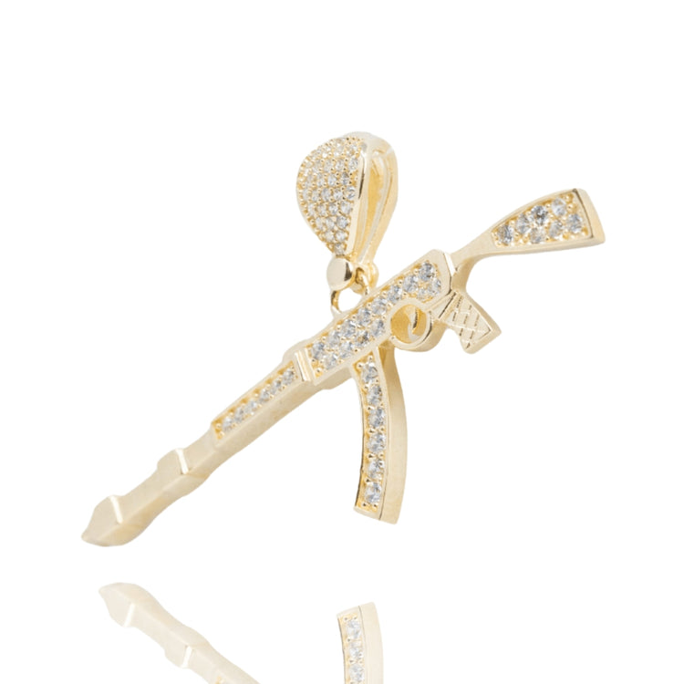 The AK-47 Firearm Pendant with CZ Stones in 14k yellow gold features a rifle-shaped design encrusted with sparkling cubic zirconia, displayed against a white background.
