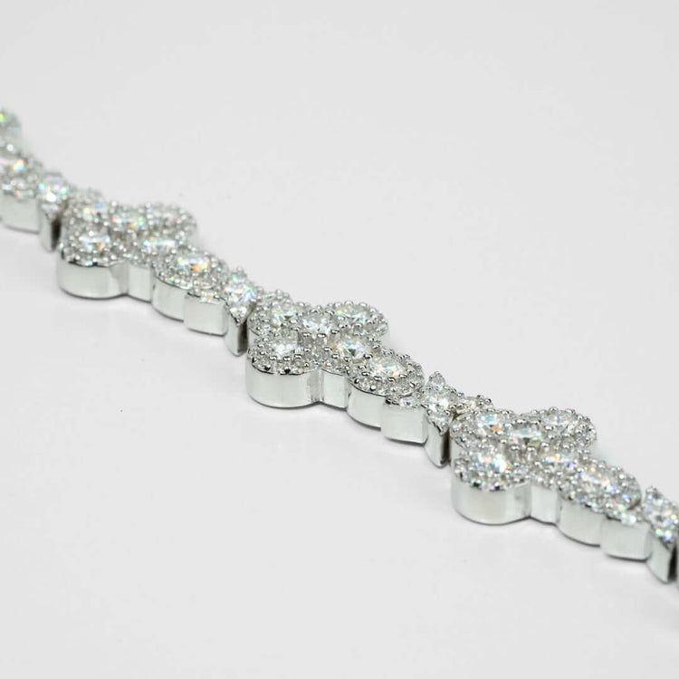 A close-up of the Moissanite Cross Fancy Bracelet, showcasing cluster-set round moissanite stones in a cross-inspired pattern, crafted from 925 sterling silver and displayed on a white background.