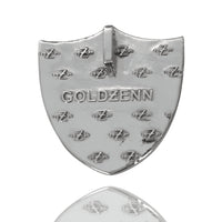 A shiny, shield-shaped Raiders Custom Pendant Moissanite in 14K White Gold with "GOLDZENN" engraved at the center and multiple small "zZz 2023" imprints, shown on a white background.