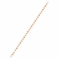 The Rose Gold Bead Bracelet - 4 mm Moon Cut is a delicate 14k rose gold piece featuring small, round moon-cut beads linked in a line, finished with a lobster clasp and small loop closure.