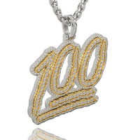 The 14k Two-Tone Gold '100' Emoji Pendant with Diamonds features gold and silver tones, sparkling diamonds, and hangs from a sleek silver chain.