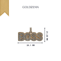 The Boss Diamond Pendant - 14k Yellow Gold, adorned with natural diamonds, measures 39.1mm wide by 21.28mm tall. Featuring the GOLDZENN brand above and a gold ribbon accent, it embodies refined elegance for any occasion.