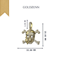 The 14K Gold Diamond Pirate Skull Pendant features a striking gold skull with crossbones, diamond accents, and a gold tooth. Dimensions: 6.95 mm (bail), 25.85 mm (height), and 33.00 mm (width).