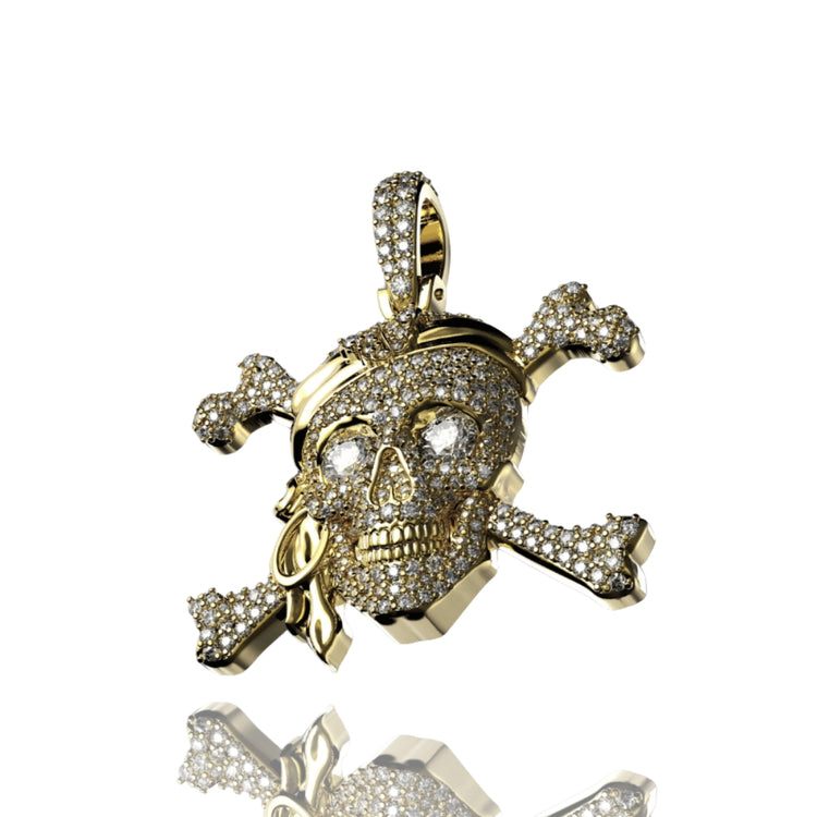The 14K Gold Diamond Pirate Skull Pendant features a skull and crossbones design with sparkling diamonds, plus a bandana and eye patch for a bold pirate look. This pendant shines brightly against a white background.