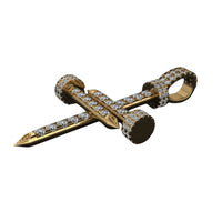 The Diamond Nail Cross Pendant – 14K Gold features diamonds set along the nail’s length, head, and loop; shown on a white background, it’s a stunning accessory for any occasion.