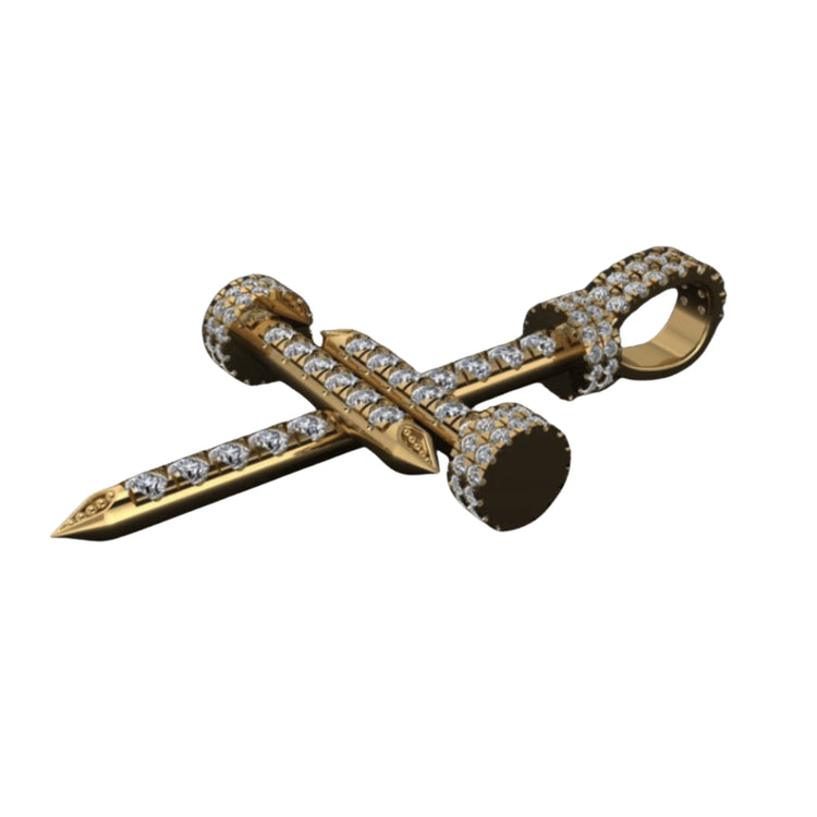 The Diamond Nail Cross Pendant – 14K Gold features diamonds set along the nail’s length, head, and loop; shown on a white background, it’s a stunning accessory for any occasion.
