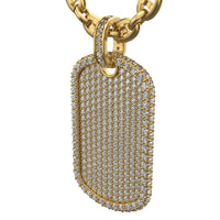 A close-up of the Diamond Dog Tag Pendant – 14K, encrusted with sparkling diamonds and suspended from a thick gold chain. The pendant features smooth, rounded edges and a polished, luxurious finish.