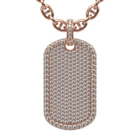 The Diamond Dog Tag Pendant – 14K is a rose gold necklace featuring a rectangular pendant encrusted with rows of sparkling white diamonds on its surface and edges.