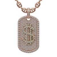 The 14K Diamond Dollar Sign Dog Tag Pendant features a rectangular gold dog tag encrusted with natural diamonds and a bold dollar sign at the center, making it a standout gold chain necklace.