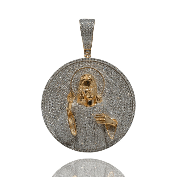 The Jesus Piece Diamond Pendant – 14K features a round gold and silver design with diamonds, showcasing a raised image of a haloed figure blessing, making it a bold, striking pendant for men.