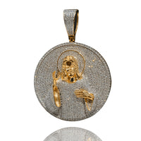 The Jesus Piece Diamond Pendant – 14K is a round silver pendant, accented with small stones and a textured bail, featuring a 14k solid gold depiction of Jesus with halo, raised right hand in blessing, and left hand on his chest.