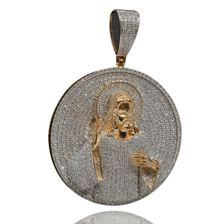 Introducing the Jesus Piece Diamond Pendant – 14K: a circular solid gold pendant showcasing a diamond-adorned depiction of Christ with halo, set on a sparkling diamond-encrusted background and finished with a gold loop for your chain.