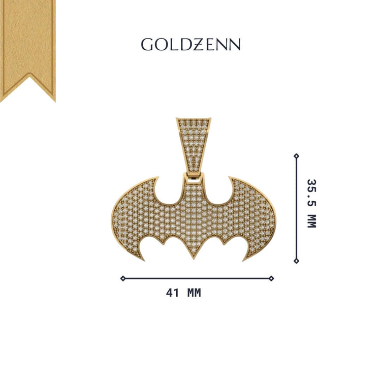 The GOLDZENN Diamond Bat Emblem Pendant - 14k features a textured, diamond-like pattern and measures 41 mm by 35.5 mm. This bold statement piece is crafted with a gold finish and showcases the GOLDZENN brand above the pendant.