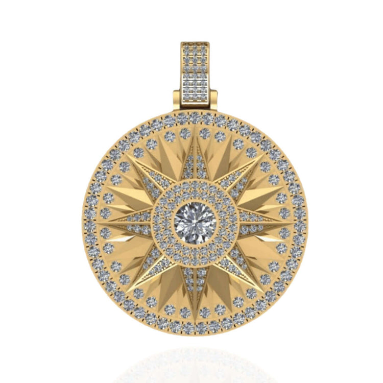 The 14k Gold Celestial Starburst Diamond Pendant features a round gold design with a large central diamond and smaller diamonds outlining the starburst and pendant’s edge.