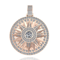 The 14k Gold Celestial Starburst Diamond Pendant showcases a round rose gold base adorned with sparkling diamonds, featuring a large central diamond encircled by smaller diamonds in striking geometric patterns.