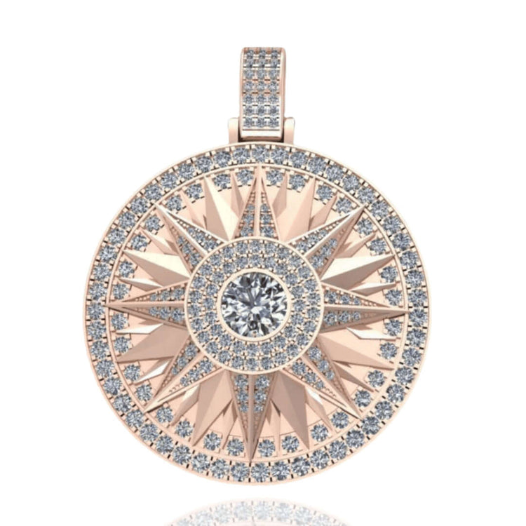 The 14k Gold Celestial Starburst Diamond Pendant showcases a round rose gold base adorned with sparkling diamonds, featuring a large central diamond encircled by smaller diamonds in striking geometric patterns.
