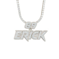 The Custom Diamond Name Pendant - Solid Yellow Gold features a diamond-encrusted necklace with “69” above “ERICK,” both in bold sparkling letters, set in dazzling 14K solid gold for a standout personalized accessory.