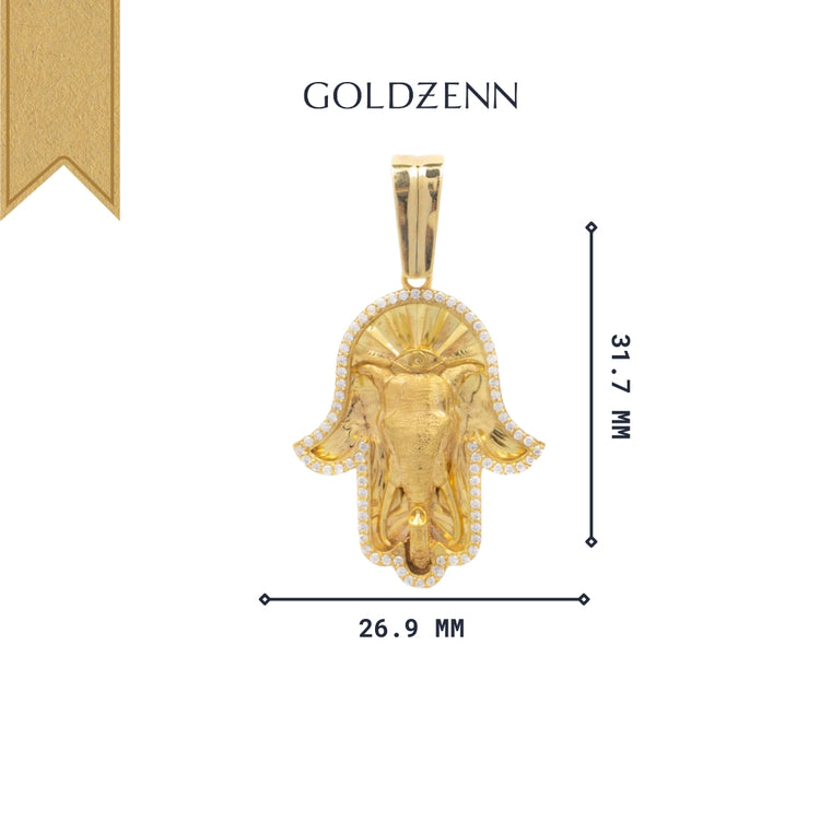 The Hamsa Hand Pendant - 10k showcases a central elephant head and sparkling stones. Crafted from zircon, it measures 31.7 mm tall by 26.9 mm wide—a unique and eye-catching addition to your jewelry collection.