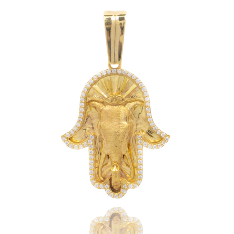 The Hamsa Hand Pendant - 10k features a gold elephant head outlined with sparkling clear stones and a polished bail, creating an eye-catching and unique piece of jewelry.