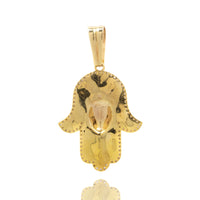 The Hamsa Hand Pendant - 10k shines with a smooth, reflective gold surface, subtle hammered texture, and dotted edge detailing, all displayed against a white background.