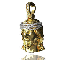 The 14K Yellow Gold Jesus Diamond Head Pendant features a bearded Jesus with detailed hair, a stone-studded crown of thorns, and a top loop—an exquisite piece of religious jewelry.