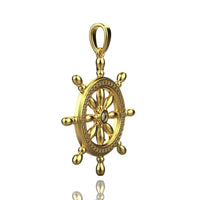 The Nautical Ship Wheel Pendant - 14k features eight spokes, sparkling diamonds along the rim, and a central gem, all set in gold against a white background.