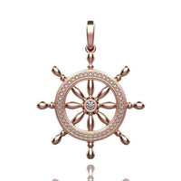 The Nautical Ship Wheel Pendant - 14k features a rose gold finish, diamond-studded circular frame, central gemstone, eight spokes, and a top loop—an elegant nautical jewelry piece for any necklace.