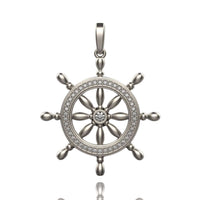 The Nautical Ship Wheel Pendant - 14k features a silver ship wheel with a central gemstone, a circle of sparkling stones, eight spokes, and a bail—perfect nautical jewelry for maritime style lovers.