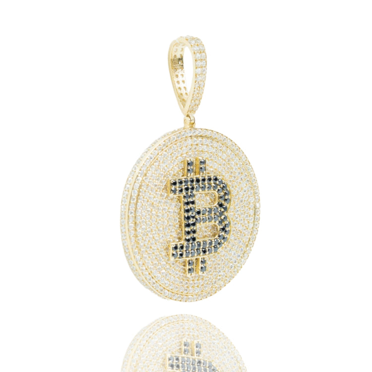 The Gemstone Bitcoin Pendant – 10K Gold Men’s Pendant features a round design with clear and black stones, a bold Bitcoin symbol at the center, and a bail for easy wear on your favorite chain—an eye-catching jewelry piece.