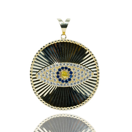 The Eye Pendant – 10k features a striking eye motif with blue, yellow, and white gemstones, set against a textured radiating background and scalloped border—a standout piece in men's jewelry.