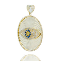 The Eye Pendant – 10k features a gold oval design with a textured radiating pattern, a central eye motif set with blue and clear stones, and a smooth gold bail—a bold choice for men's jewelry.