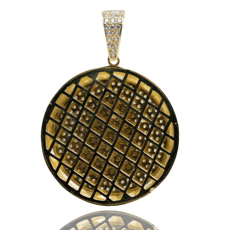 The Christ Circular Portrait Pendant - 10k Gold features a gold and black circular design with a waffle grid pattern, sparkling stones, and a gemstone-encrusted bail—a bold religious jewelry piece.