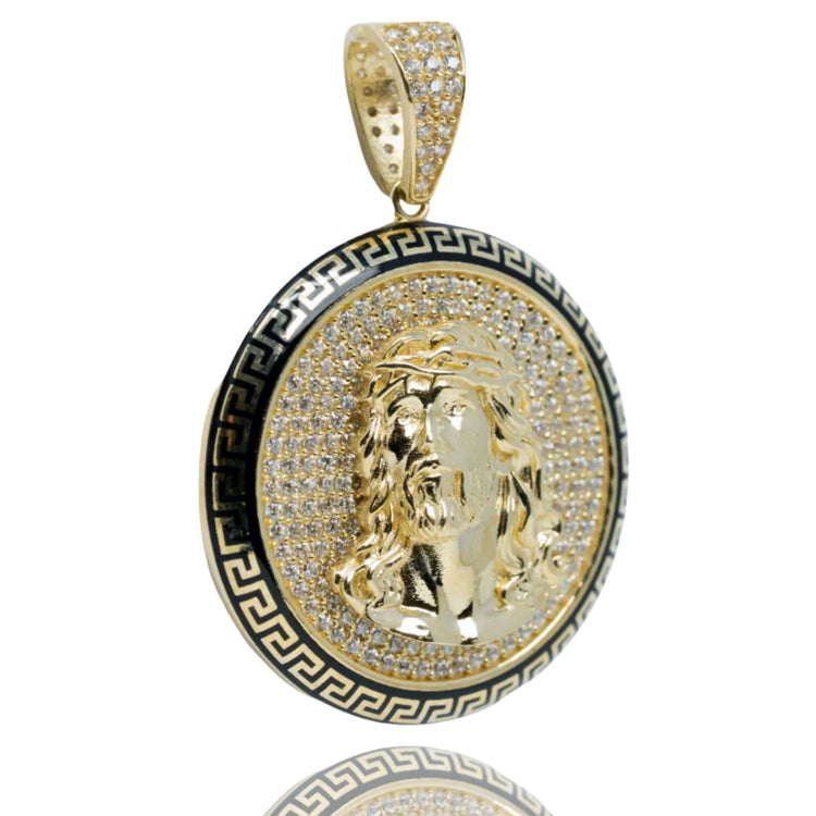 The Christ Circular Portrait Pendant - 10k Gold features a detailed Jesus face with a crown of thorns, sparkling stones, and a black Greek key border. Its encrusted bail adds brilliance, making this pendant a striking piece of religious jewelry.